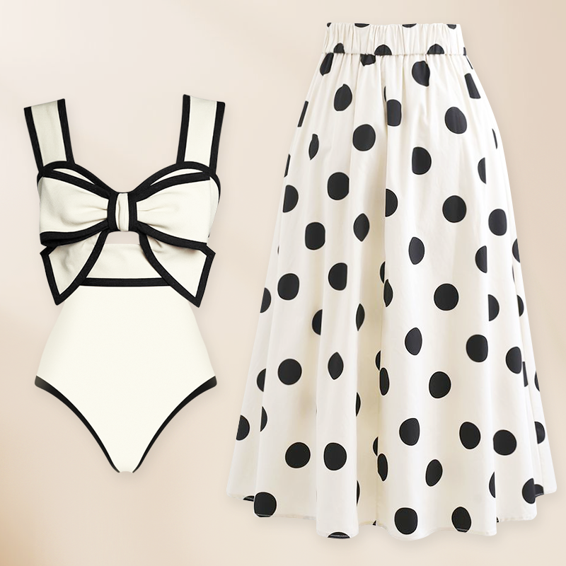 Conjunto de baño de una pieza con falda y diseño de lazo en blanco y negro