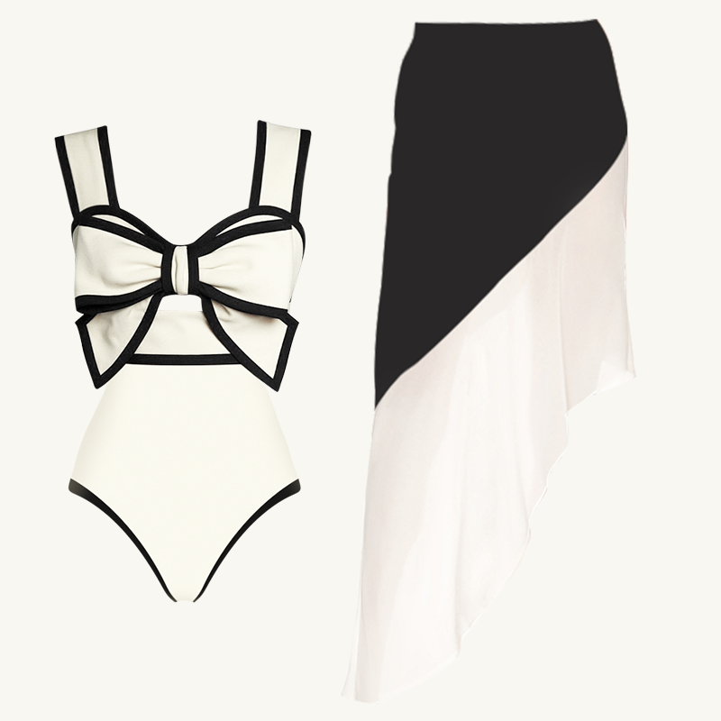 Conjunto de baño de una pieza con falda y diseño de lazo en blanco y negro