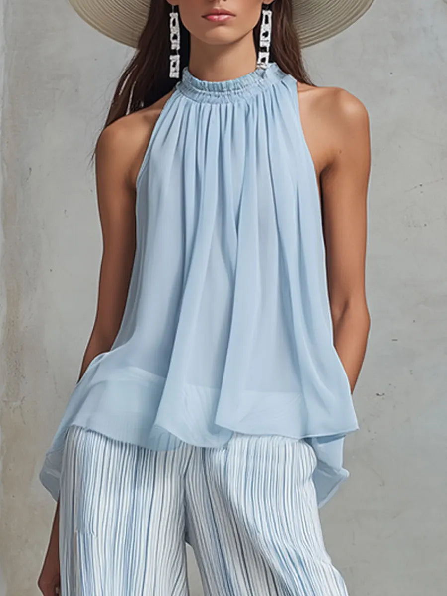 Conjunto elegante con top sin mangas y pantalones anchos a rayas