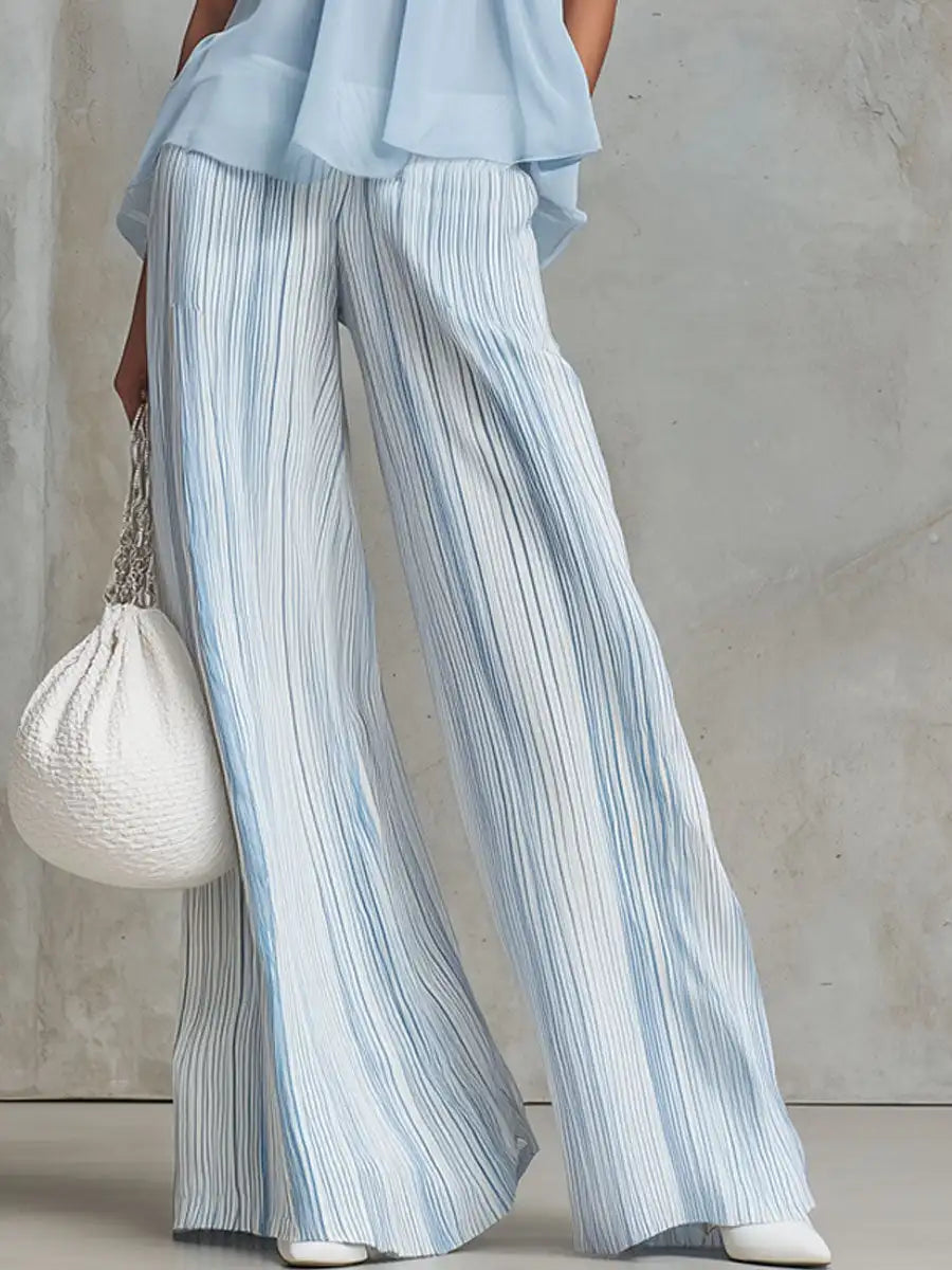 Conjunto elegante con top sin mangas y pantalones anchos a rayas